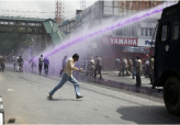 Painting Protesters Purple in Kashmir                                                               